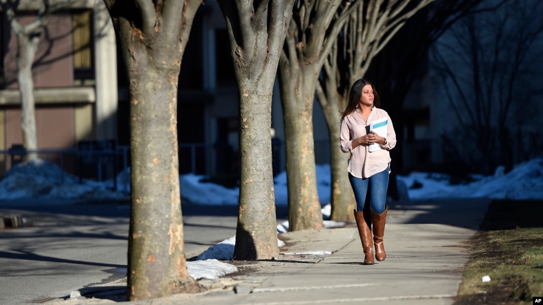 FILE - A students walks through the campus of Nassau Community College Garden City, New York, Feb. 2, 2016. A new study has found that up to 14 percent of U.S. community college students were homeless and that two thirds of students go hungry.