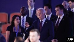 President Joe Biden does a stage check before the start of the first day of the Democratic National Convention at the United Center in Chicago, Illinois, on Aug. 19, 2024.