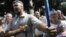 Ukrainian opposition supporters sing national anthem during a protest, Kiev, July 30, 2012.