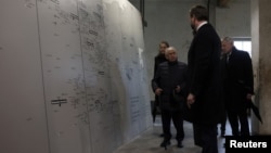 U.S Vice President JD Vance speaks with Abba Naor, a Holocaust survivor who was held at Dachau, at the Dachau Concentration Camp Memorial Site in Dachau, Germany, Feb. 13, 2025.