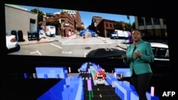 FILE - Aicha Evans, CEO of the self-driving technology development company Zoox, speaks during a keynote session at the Amazon Re:MARS conference on robotics and artificial intelligence in Las Vegas, Nevada, June 6, 2019.