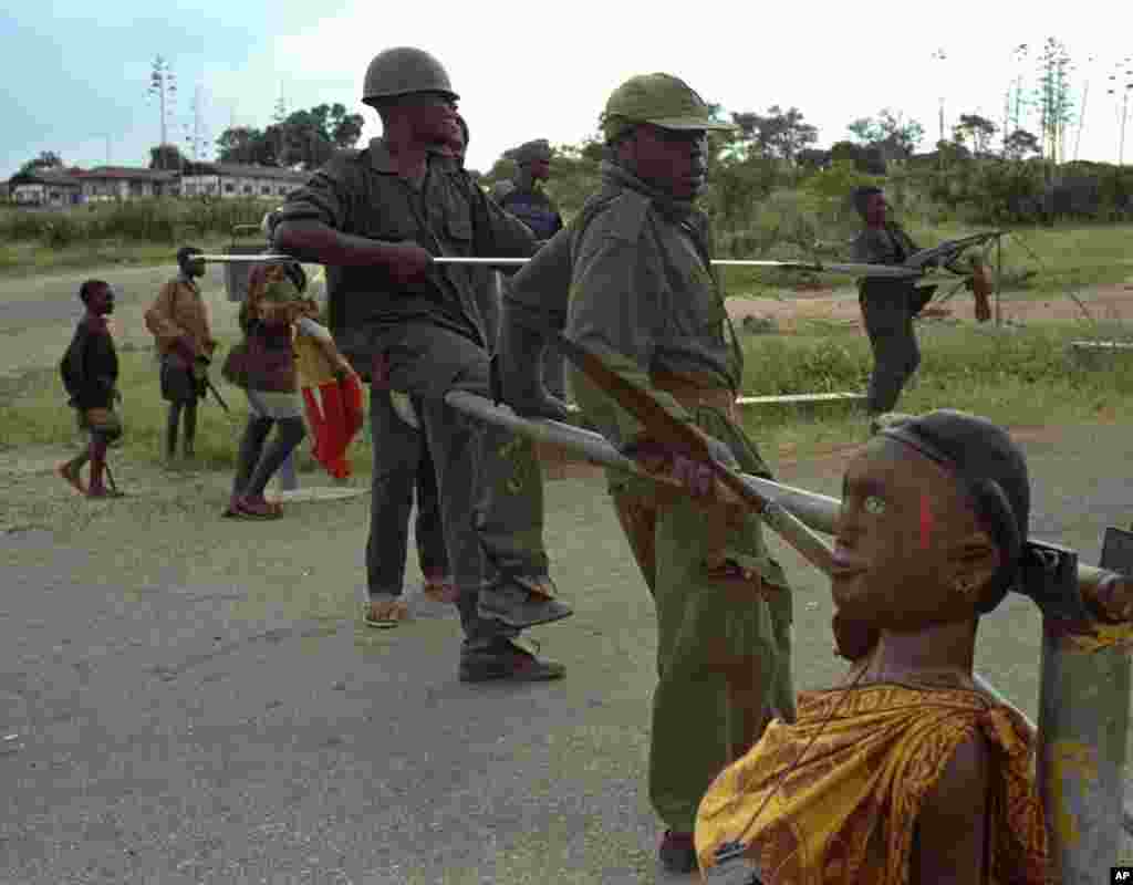 Local communities around the park responded to the threat of outside militias by forming their own small armies called Mai Mai. They often recruit child soldiers at checkpoints such as this one near Goma in 1997.