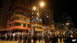 Riot policemen arrive to disperse the residents and protesters at Sham Shui Po district in Hong Kong, Aug. 7, 2019.