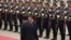 Chinese President Xi Jinping inspects an honor guard with Venezuelan President Nicolas Maduro (L) at a welcoming ceremony outside the Great Hall of the People in Beijing, Sept. 22, 2013.