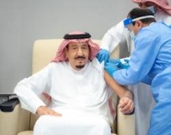 Saudi King Salman bin Abdulaziz gets a dose of a coronavirus disease vaccine in Neom, Saudi Arabia, Jan. 8, 2021.