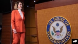 House Minority Leader Nancy Pelosi, D-Calif., arrives to face reporters at a news conference at the Capitol in Washington, Thursday, Nov. 15, 2018.