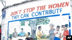 Activists say one way to help fight domestic violence in Africa would be to have more women's representation in politics, as this sign in Monrovia, Liberia, suggests