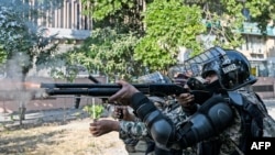 Paramilitary soldiers fire rubber bullets to disperse supporters of the Pakistan Tehreek-e-Insaf (PTI) party during a protest demanding the release of former prime minister Imran Khan, at the Red Zone area in Islamabad on November 26, 2024.