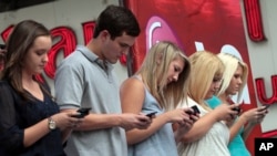 Texting can lead to strain and injury, otherwise known as text neck. Here, contestants compete in a texting championship in New York, Aug. 8, 2012.