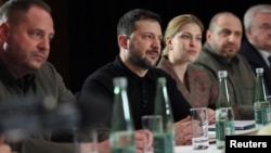 Ukrainian President Volodymyr Zelenskyy, 2nd left, attends a bilateral meeting with U.S. Vice President JD Vance, not pictured, on the sidelines of the Munich Security Conference, in Munich, Germany, Feb. 14, 2025.