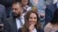 FILE - Britain's Kate, Duchess of Cambridge sits in the Royal Box on Centre Court on day five of the Wimbledon Tennis Championships in London. The Duchess of Cambridge is now self-isolating after a contact tested positive for the coronavirus.