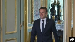 FILE - French President Emmanuel Macron is seen at the Elysee Palace in Paris, France, May 23, 2017. On Monday, Macron will host Russian President Vladimir Putin in what will be their first meeting.