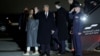 U.S. President-elect Donald Trump, center, waves as he arrives at Washington Dulles International Airport in the state of Virginia, Jan. 18, 2025.