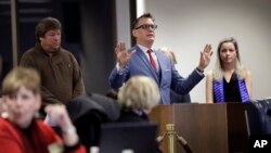 Barry Brake, center, addresses the Texas school board during public testimony on history curriculum, Nov. 13, 2018, in Austin, Texas. 