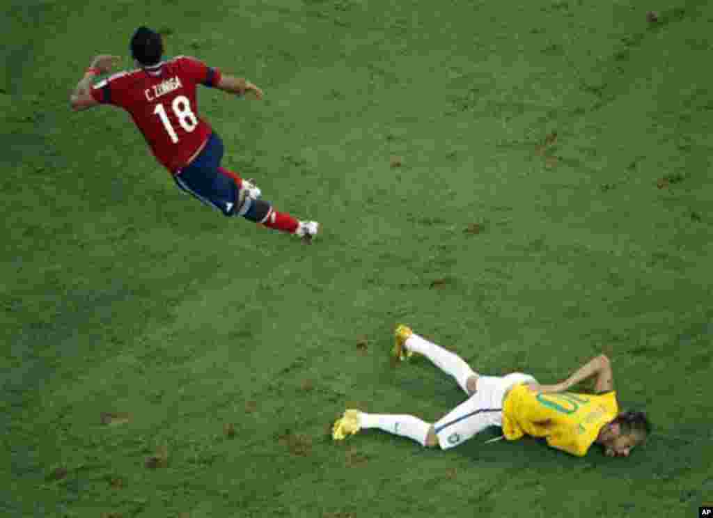 Brazil's Neymar grimaces in pain during the World Cup quarterfinal soccer match between Brazil and Colombia at the Arena Castelao in Fortaleza, Brazil, Friday, July 4, 2014. Brazil's team doctor says Neymar will miss the rest of the World Cup after breaki