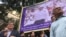 Lawmakers and high-ranking officials of Cambodia National Rescue Party(CNRP) hold banner in front of the party's headquarters in Phnom Penh to demand the release of Kem Sokha, the party current leader, September 25, 2017. (Kann Vicheika,VOA Khmer)