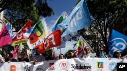 Public sector workers hold unions flags during a demonstration in Marseilles, southern France, May 9, 2019.