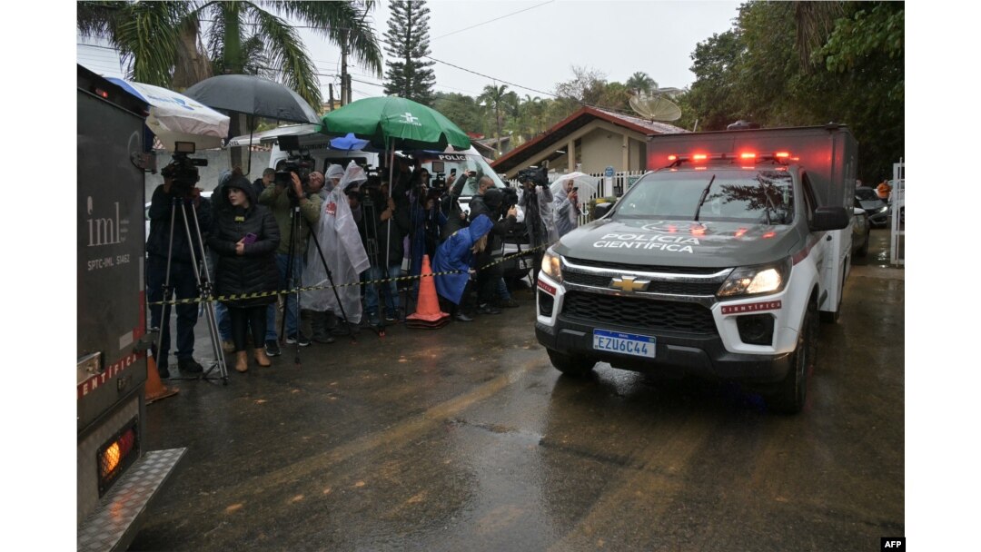 A police forensic truck leaves the Recanto Florido Condominium, where an airplane crashed with 62 people on board in Vinhedo, Sao Paulo, Brazil, on Aug. 10, 2024.