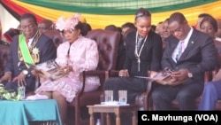 FILE: President Emmerson Mnangagwa and his wife Auxillia and vice president Constantino Chiwenga and his wife Mary follow inauguration proceedings, Aug. 26, 2018, in Harare.