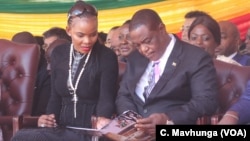 FILE: Vice President Constantino Chiwenga and his wife, Mary, follow inauguration proceedings, Aug. 26, 2018, in Harare.