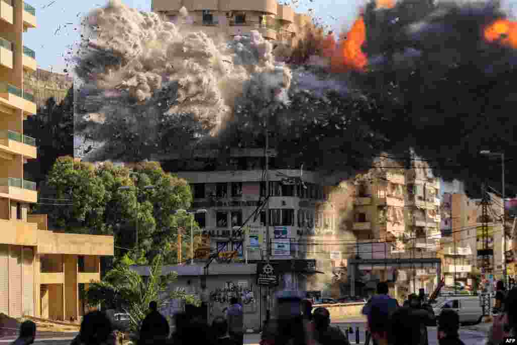 Fire and smoke erupt from a building just after an Israeli airstrike in Beirut&#39;s southern Shayah neighborhood, amid the ongoing war between Israel and Hezbollah.