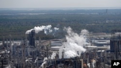 FILE - The Shell Norco refinery is seen in Norco, Louisiana, March 8, 2018. The world may be heading into an oversupply of oil, and that possibility is hanging over members of the OPEC cartel, which will meet Dec. 5, 2019.