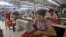 Myanmar laborers work in a garment factory on the outskirts of Yangon.