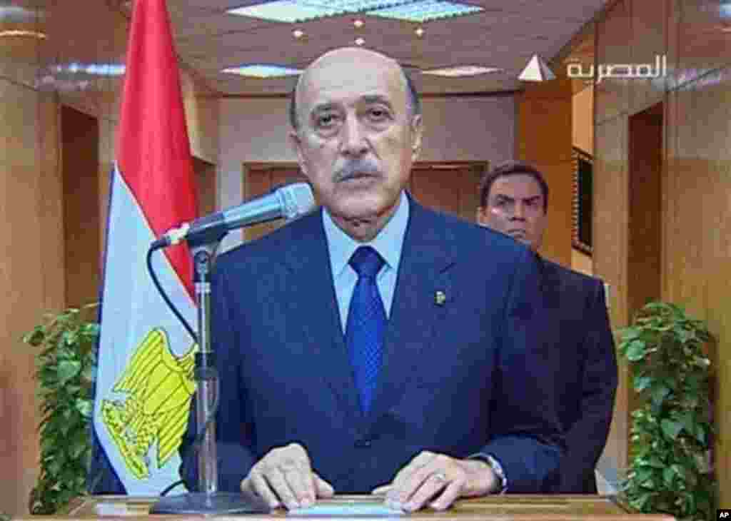 In this photo taken from Egyptian television, Egypt's vice president Omar Suleiman makes the announcement that Egyptian President Hosni Mubarak has stepped down from office, Friday, Feb. 11, 2011, in Cairo, Egypt. (AP Photo/Egypt TV)