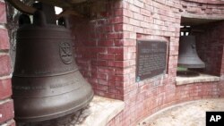 FILE - Two of the bells of Balangiga at F.E. Warren Air Force Base outside Cheyenne, Wyo., shown in May 2001, that signaled an attack by Filipino insurgents on occupying American troops in 1901.