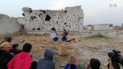 Musician Brings Donated Instruments to Syrian Kids
