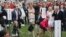 President Donald Trump, right, blows a whistles to start a race for his grandchildren from l-r, Chloe, Spencer, Donald Trump Jr. III, and Kai Madison, at the annual White House Easter Egg Roll on the South Lawn of the White House in Washington, April 2, 2