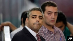 Al-Jazeera သတင်းထောက်တွေ ဖြစ်ကြတဲ့ အီဂျစ်နဲ့ကနေဒါ နှစ်နိုင်ငံသားခံယူထားသူ Mohamed Fahmy နဲ့ အီဂျစ်နိုင်ငံသား Baher Mohamed