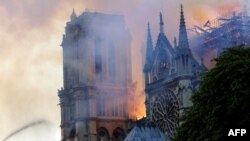 The landmark Notre-Dame Cathedral is engulfed by flames in central Paris on April 15, 2019.