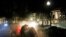 Protesters take cover from tear gas fired by police outside the Kenosha County Courthouse, Aug. 24, 2020; in Kenosha, Wis. during a second night of clashes after the police shooting of Jacob Blake a day earlier.