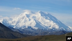 FILE - Denali, Mt. McKinley at the time, is seen on a sunny day Aug. 19, 2011, in Denali National Park, Alaska. Denali is the highest mountain peak in North America and the United States, with a summit elevation of 6,194 meters (20,320 feet).