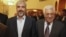 In this photo provided Nov. 24, 2011 by the office of Khaled Meshaal, Palestinian Hamas leader Khaled Mashaal, left, and Palestinian President Mahmoud Abbas are seen together during a meeting in Cairo, Egypt. 