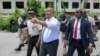 Haitian prime minister tours Port au Prince hospital after police take it back from gang control