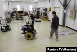 A Korea Institute of Machinery and Materials researcher controls a wheelchair with morphing wheels in Daejeon, South Korea November 5, 2024, in this still image taken from video. (Reuters TV/via REUTERS)