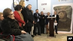 Cecilia Gimenez (L) who restored a version of 'Ecce Homo' mural by 19th century painter Elias Garcia Martinez, attends the inauguration of a new center in Borja, Zaragoza, Spain, March 16, 2016. 