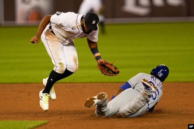 FILE - Kansas City Royals' Erick Mejia steals second base under the tag of Detroit Tigers shortstop Willi Castro (49)in the ninth inning of a baseball game in Detroit, Wednesday, Sept. 16, 2020. (AP Photo/Paul Sancya)