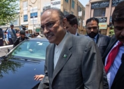 FILE - Former Pakistani president Asif Ali Zardari, center, leaves the High Court building, in Islamabad, June 10, 2019.