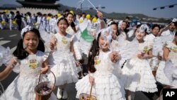 FILE - Children dressed as angels march during an Easter parade in Seoul, South Korea, on April 9, 2023. (AP Photo/Lee Jin-man, File)