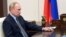 Russian President Vladimir Putin attends a meeting via video conference at the Novo-Ogaryovo residence outside Moscow, Russia, Aug. 25, 2020.