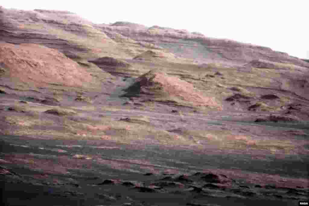 This photo, taken by the Curiosity rover, shows the layered geology of Mars. 