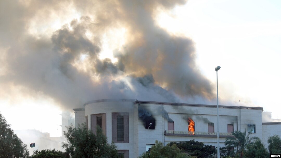 Smoke rises from the site of the headquarters of Libya's foreign ministry after suicide attackers hit in Tripoli, Libya Dec. 25, 2018.
