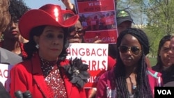 Representative Frederica Wilson of Florida, left, gathers with Nigerian girls and other U.S. lawmakers Thursday on the U.S. Capitol to mark the two-year anniversary of the abduction of more than 200 girls from Nigeria by the militant group Boko Haram. (C. Saine/VOA)