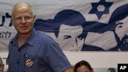 Noam, left, and Aviva Schalit, parents of captured Israeli soldier Gilad Schalit, sit in a protest tent set up outside the Prime Minister's residence in Jerusalem, October 11, 2011.