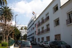 The German and EU flags on the German embassy building in Rabat, Morocco, March 2, 2021. Morocco's Foreign Ministry has suspended ties with the German Embassy because of unspecified "deep misunderstandings."