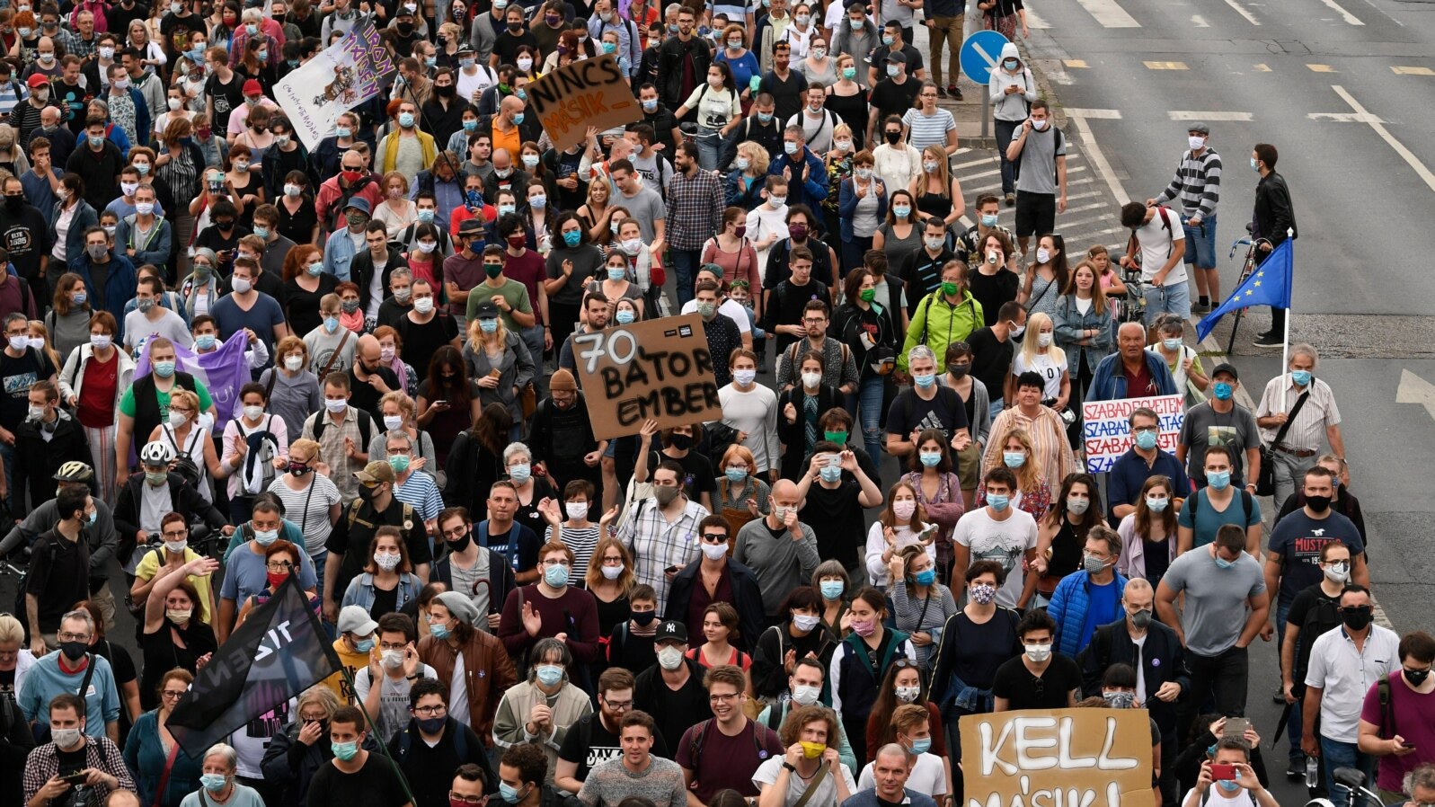 FILE - Demonstrators protesting the dismissal of the editor-in-chief of the Hungarian news website Index.hu march in the streets of Budapest, Hungary, July 24, 2020.