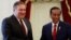 Indonesia's President Joko Widodo, right, shakes hands with U.S. Secretary of State Mike Pompeo before their meeting at the Presidential Palace in Jakarta, Indonesia, Aug. 5, 2018.